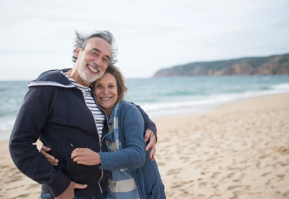 Smiling older couple enjoying the beach after saving their relationship with Marriage Helper Couples Workshop Columbia TN