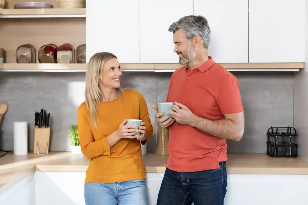 Happy and contented couple in their kitchen after joining in Marriage Helper couples workshop in Murfreesboro, TN - save your marriage